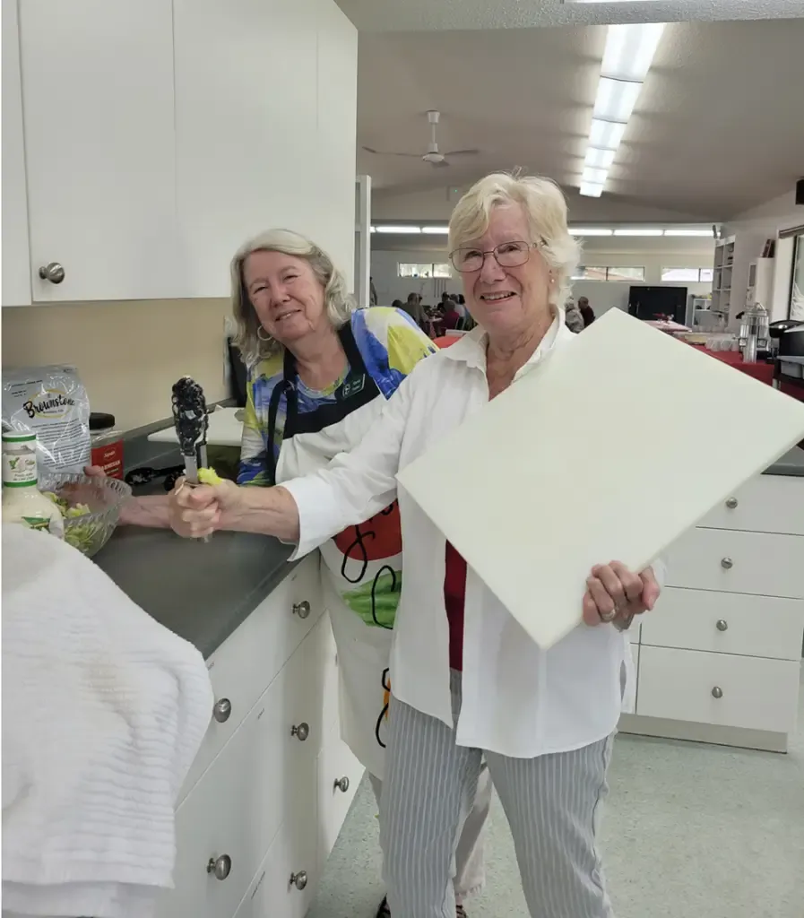 Ladies getting things prepared in the kitchen.
