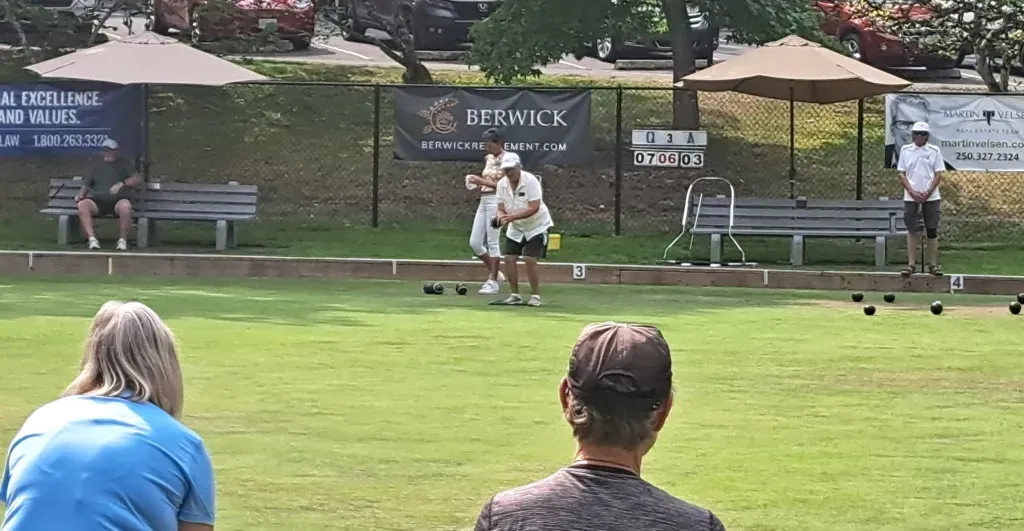 Watching a couple of lawn bowling games.