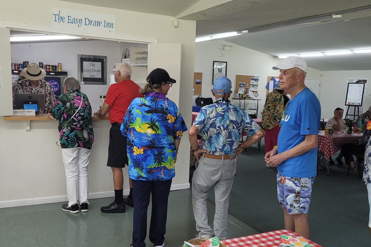 Lining up indoors on Hawaiian Day