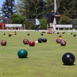 close up of a field full of lawn bowls