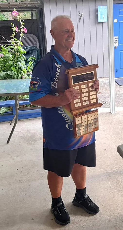 Holding up a plaque