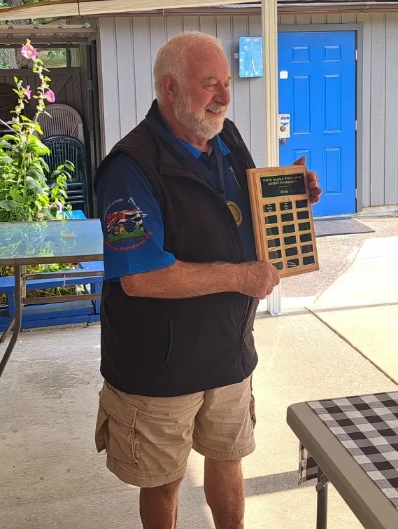 Holding up a plaque