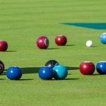 Multiple bowls and jack outdoors