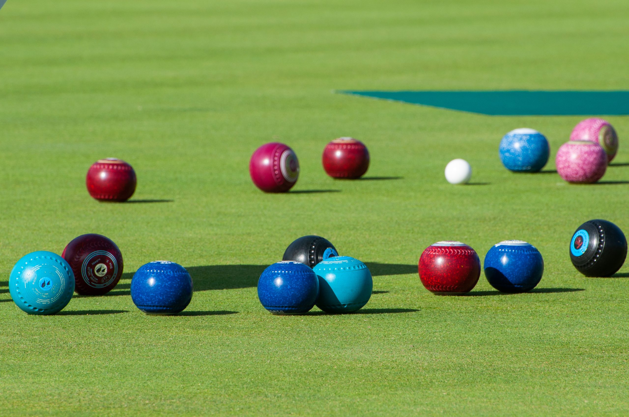 Multiple bowls and jack outdoors